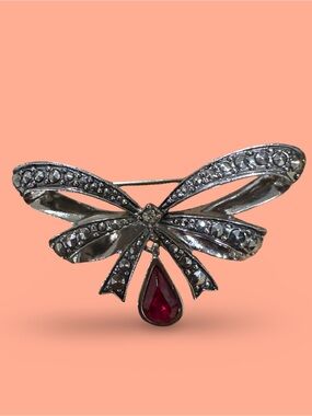 Silver Bow Brooch with Red Teardrop Stone